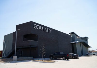 A modern building and a car parked in front of it